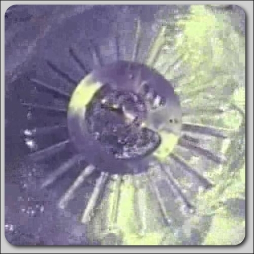 Video Still.  Still of working 1/100 scale model of Dam-Atoll from video.  This icon represents the video of Dam-Atoll.  Title:  Dam-Atoll Still 0.  &copy;Dam-Atoll, Inc.